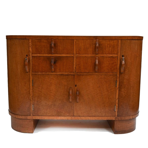 380 - Heal's, London, an Art Deco oak sideboard, circa 1930, crossbanded top, four graduated frieze drawer... 