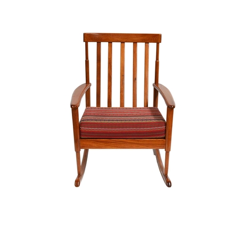 384 - A mid-Century Danish wooden rocking chair, bar back, the seat cushion re-upholstered in Paul Smith '... 