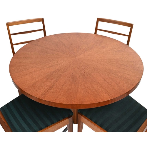 387 - McIntosh of Kirkcaldy, a mid-Century teak dining set, 1960's, comprising circular rise and fall dini... 