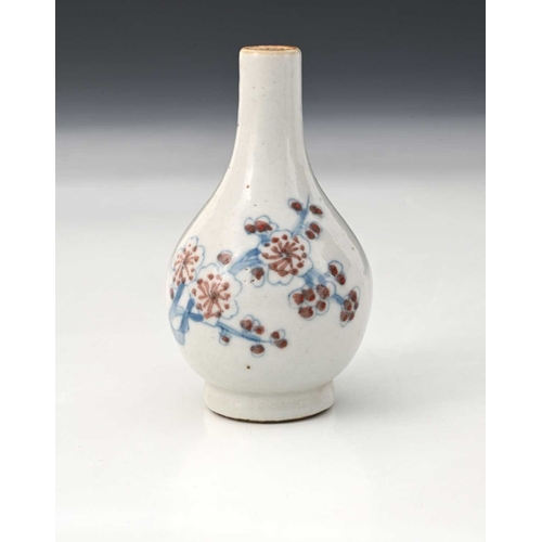 396 - A Chinese miniature bottle vase, Wucai style, baluster form with underglaze blue prunus design, XXcm... 