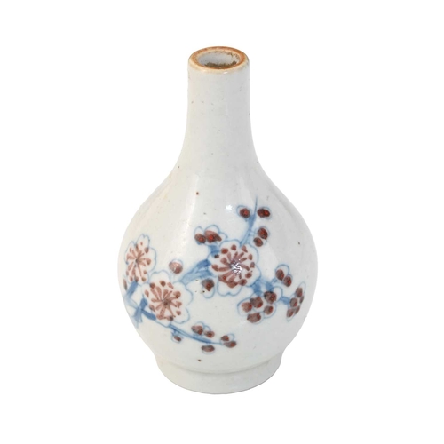 396 - A Chinese miniature bottle vase, Wucai style, baluster form with underglaze blue prunus design, XXcm... 