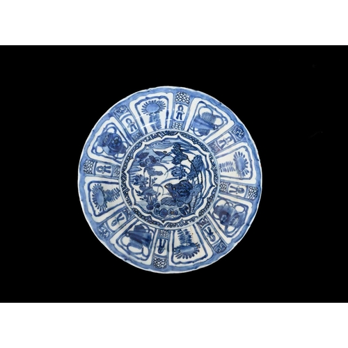 397 - A Chinese blue and white Kraak dish, the centre decorated with a fog amongst foliage, the border wit... 