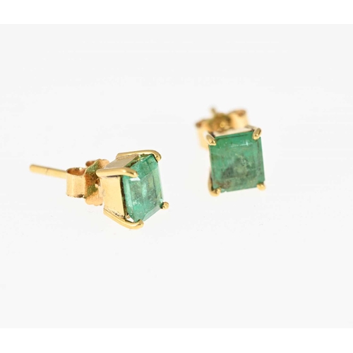 40 - A pair of gold rectangular-shape emerald single-stone stud earrings, estimated total emerald weight ... 