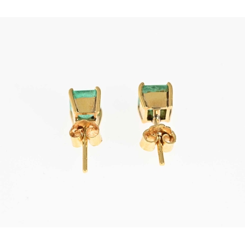 40 - A pair of gold rectangular-shape emerald single-stone stud earrings, estimated total emerald weight ... 