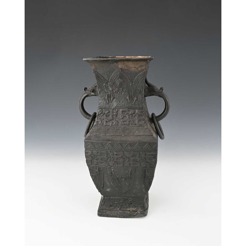 404 - A Chinese bronze vase, inverse baluster rectangular section, with zoomorphic ring handles, in the ar... 