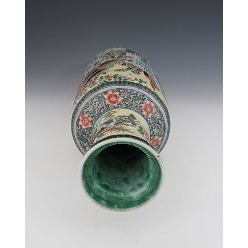 409 - A Chinese rolo shaped vase, famille verte on yellow ground, decorated in the round with fantastic bi... 