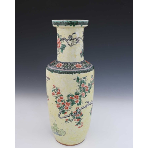 409 - A Chinese rolo shaped vase, famille verte on yellow ground, decorated in the round with fantastic bi... 