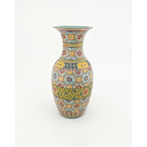 423 - A large Chinese famille rose vase, shouldered form, yellow ground, painted with panels of courtly in... 