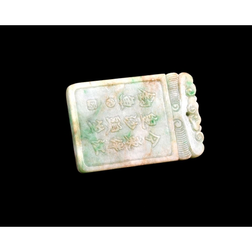 434 - A Chinese carved jade pendant, rectangular form, one side with a verse