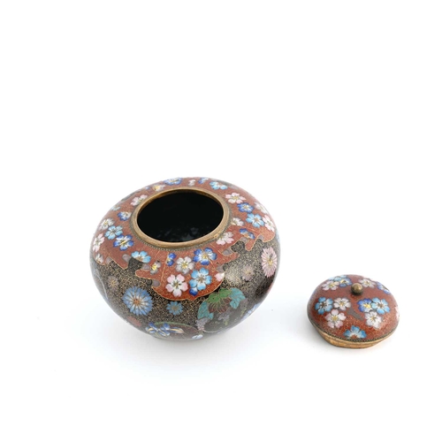 436 - A Chinese cloisonne koro, ovoid form with cover, decorated with chrysanthemums and peonies on a red ... 