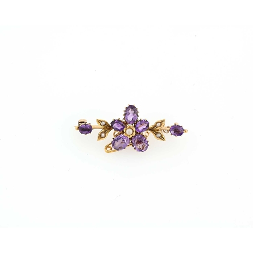 45 - An early 20th century 18ct gold amethyst and split pearl floral bar brooch, hallmarks for Birmingham... 