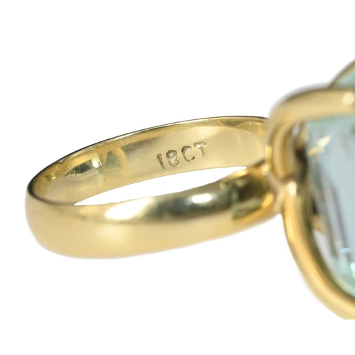 52 - A yellow metal aquamarine single-stone ring, aquamarine estimated weight 10ct, band stamped 18ct, ri... 