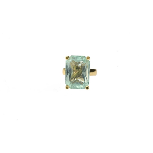 52 - A yellow metal aquamarine single-stone ring, aquamarine estimated weight 10ct, band stamped 18ct, ri... 