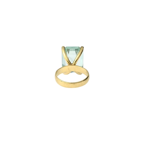 52 - A yellow metal aquamarine single-stone ring, aquamarine estimated weight 10ct, band stamped 18ct, ri... 