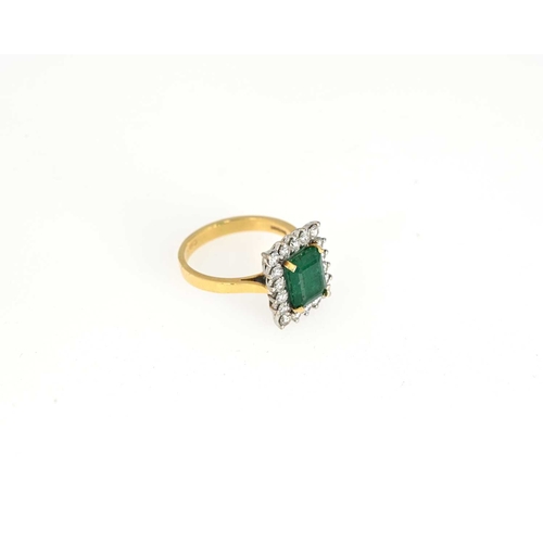 53 - An 18ct gold emerald and brilliant-cut diamond cluster ring, total diamond weight 0.80ct, engraved t... 