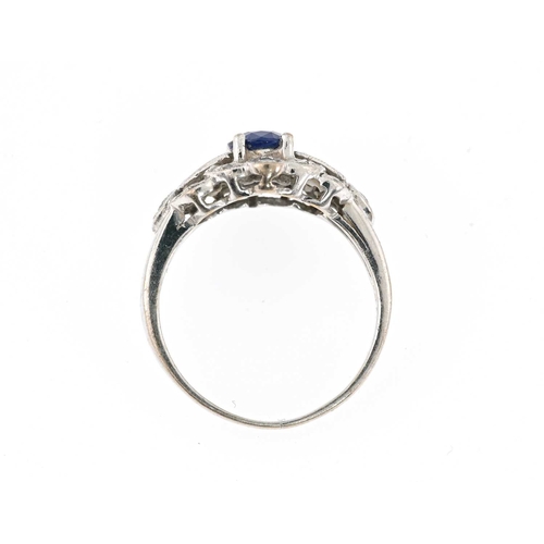 56 - An 18ct gold sapphire and vari-cut diamond dress ring, sapphire weight 0.94ct, total diamond weight ... 