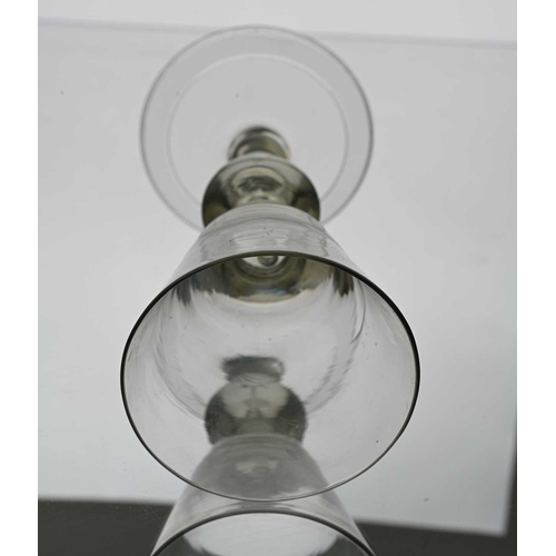 633 - An acorn knopped heavy baluster wine glass, circa 1715, the conical bowl with air bubble inclusion t... 