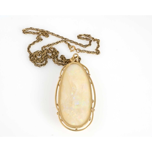 65 - An 18ct gold opal cabochon single-stone pendant, with wirework surround, suspended from a yellow met... 