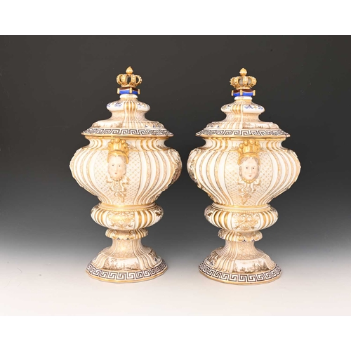 682 - A large pair of Meissen style Dresden vases and covers, twin handled double ogee urn form with mask ... 