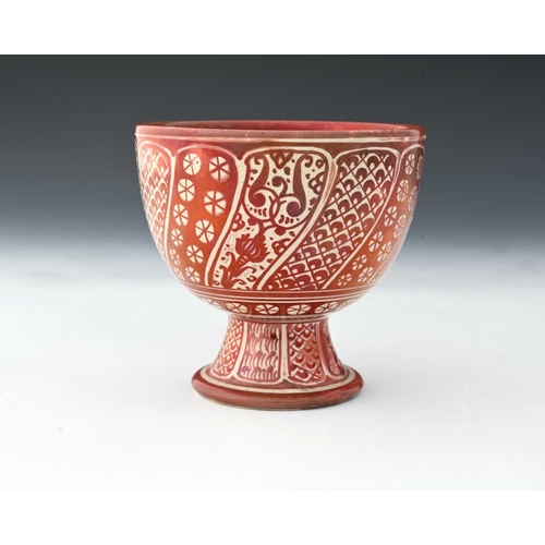 684 - Ulisse Cantagalli, a Hispano Moresque red lustre footed bowl, circa 1890, rounded form on splayed co... 