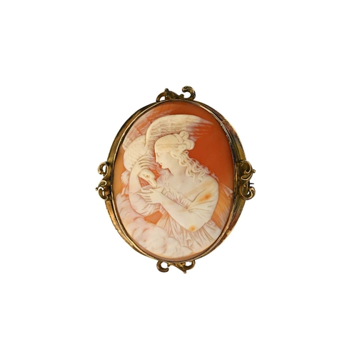 69 - An Art Nouveau yellow metal mounted shell cameo brooch, carved to depict Leda and the Swan, within a... 