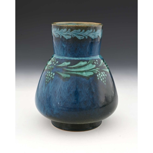 754 - Ruskin Pottery, an early vine painted Souffle glazed vase, circa 1900, conical baluster form with cy... 