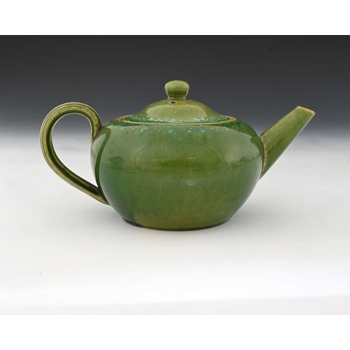 755 - Ruskin Pottery, a Souffle and slip decorated teapot, circa 1900, quat ovoid form, green tocky glaze ... 