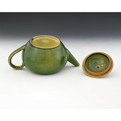 755 - Ruskin Pottery, a Souffle and slip decorated teapot, circa 1900, quat ovoid form, green tocky glaze ... 