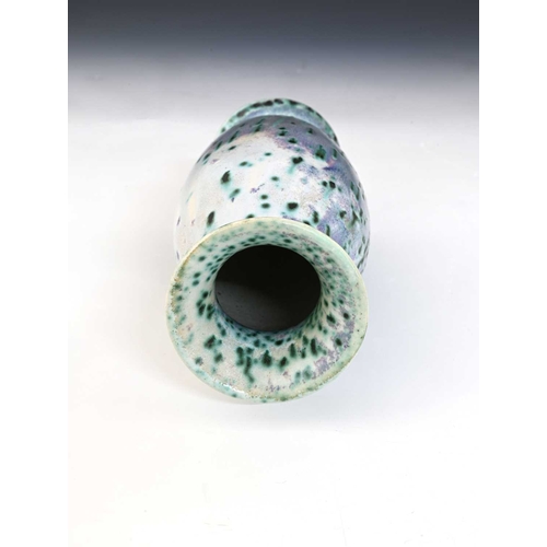 767 - Ruskin Pottery, a High Fired vase, circa 1910, footed barrel form with everted rim, mottled and spec... 