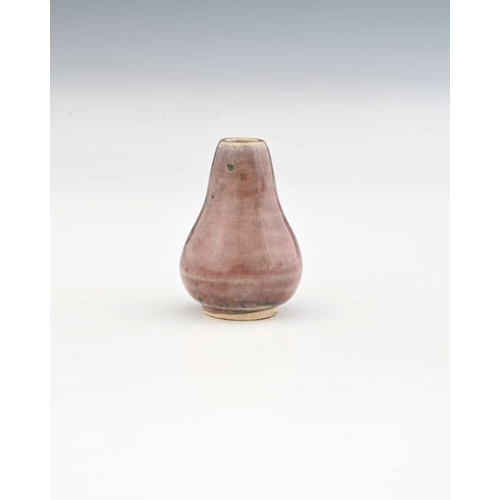 769 - Ruskin Pottery, a miniature High Fired vase, circa 1920, conical gourd form, liver coloured sang de ... 