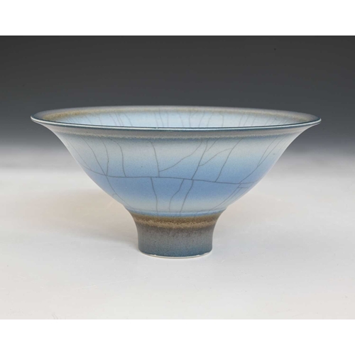 795 - David White (British, 1934-2011), a wide/ low porcelain bowl, decorated with blue, soft grey, and ta... 