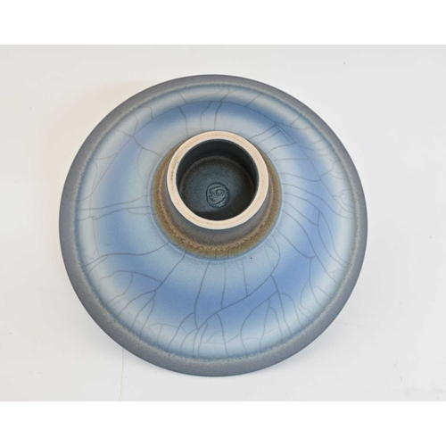 795 - David White (British, 1934-2011), a wide/ low porcelain bowl, decorated with blue, soft grey, and ta... 