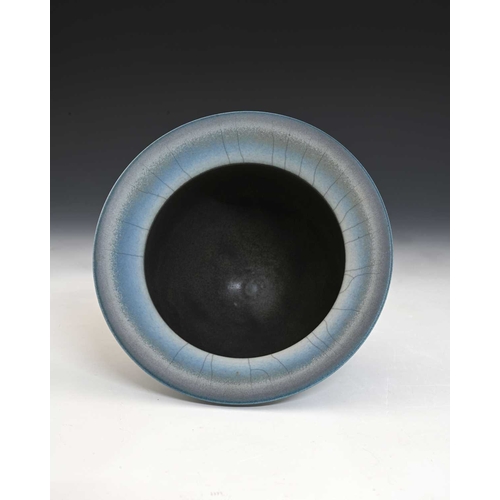 805 - David White (British, 1934-2011), a deep porcelain bowl with a wide rim, decorated with a blue and s... 