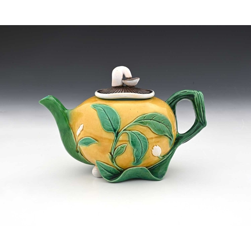 816 - A Minton Majolica teapot, 1862, modelled in relief as a gourd with leafy branch handle and mushroom ... 