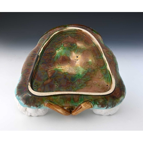 818 - A George Jones majolica strawberry dish, 1876, modelled in relief as a lily pad on basket weave grou... 