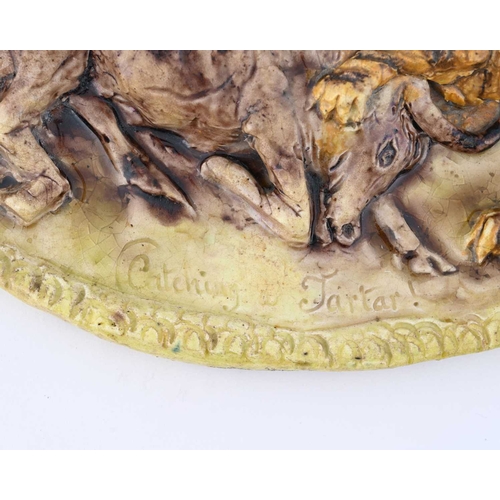 836 - A relief modelled oval pottery plaque, circa 1790, depicting a tiger attacking a bull, inscribed Cat... 