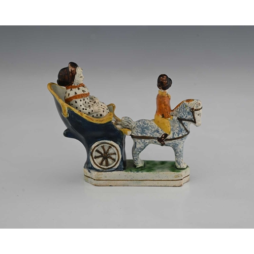 850 - A small Staffordshire Prattware figure of a horse and carriage, circa 1820, sponge decorated, modell... 