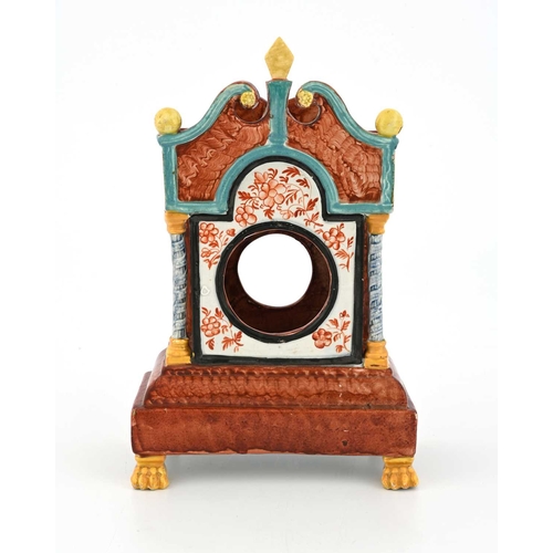 855 - A Staffordshire sponge decorated pearlware watch holder, modelled as a squat longcase clock, on lion... 