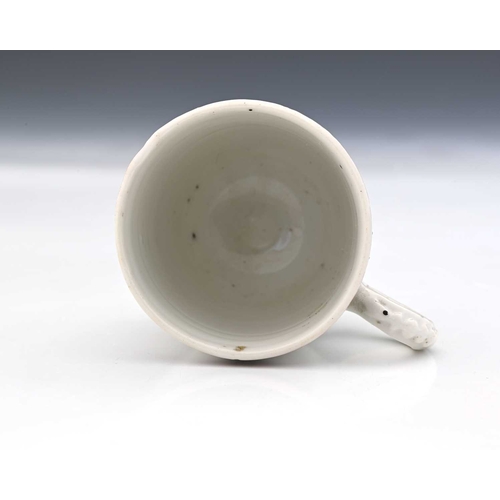 858 - A Chinese export coffee cup, circa 1780, painted with a British naval ship with Union Jack, below fa... 