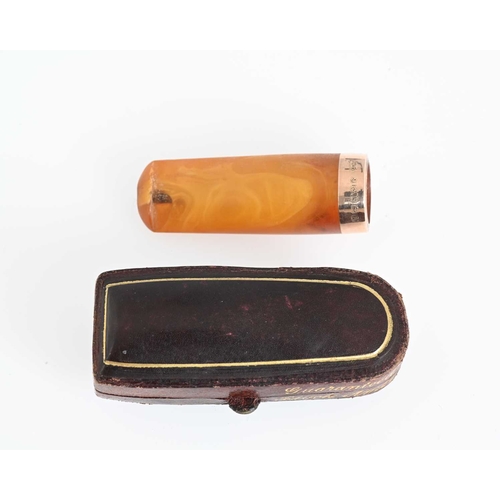 9 - An Edwardian 9ct gold mounted amber cheroot, hallmarks for Birmingham 1910, with case, length 4.8cm,... 