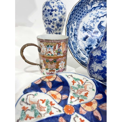 1 - A collection of Chinese and Japanese ceramics including a pair of blue and white painted inverse bal... 