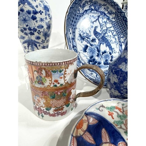 1 - A collection of Chinese and Japanese ceramics including a pair of blue and white painted inverse bal... 