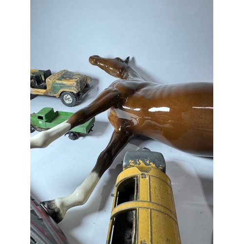 101 - A large Beswick horse 37cm long, 29cm high together with model cars and planes, 'Tri-ang', 'Dinky' e... 