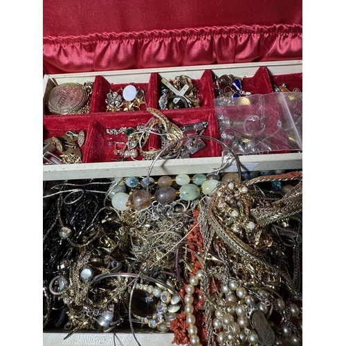 111 - A vintage jewellery box with contents, a large collection of costume jewellery