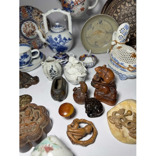 113 - A collection of Oriental ceramics and netsuke, including 18th century Kutani type teapot, Chinese bl... 