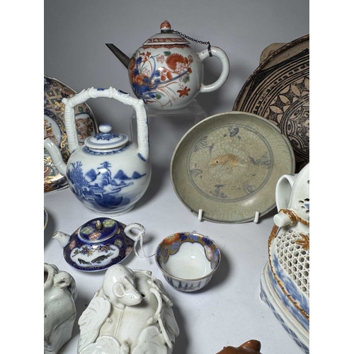 113 - A collection of Oriental ceramics and netsuke, including 18th century Kutani type teapot, Chinese bl... 