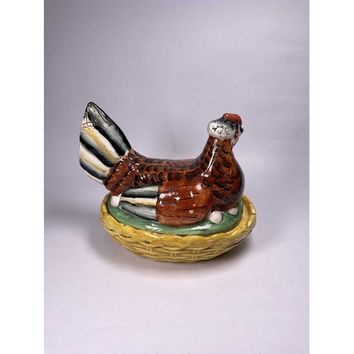 128 - A Staffordshire hen tureen and cover, the brown hen is hand painted with a red crown and black and w... 