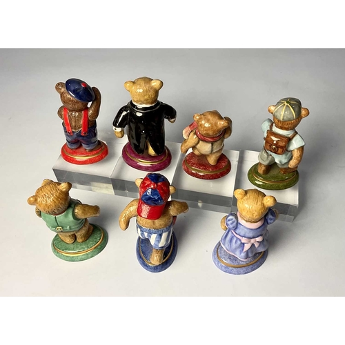 131 - A set of seven Halcyon Days porcelain 'Teddy of the Year' teddy bears, (six boxes) 8cm high (7)... 