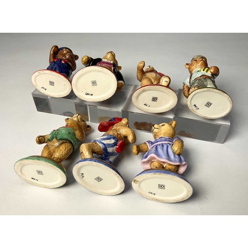 131 - A set of seven Halcyon Days porcelain 'Teddy of the Year' teddy bears, (six boxes) 8cm high (7)... 