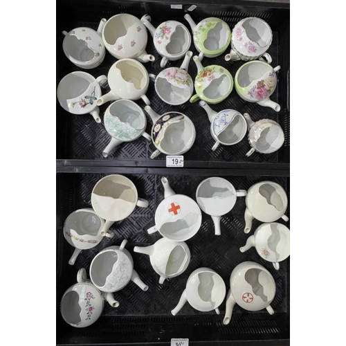 19 - A large collection of invalid/child feeding cups, including early 20th century examples from the Bri... 